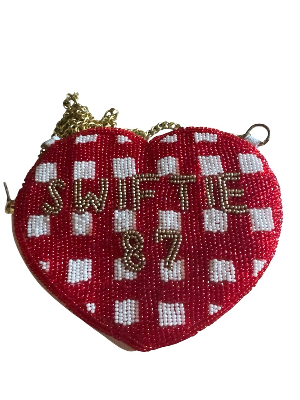 This "Swiftie" beaded heart coin purse features a red and white gingham pattern